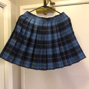 Striped school girl skirt. Comes to mid thigh. Colors are blue and white.